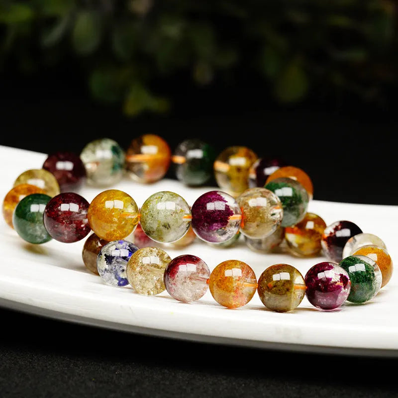 Crystal bracelet with 10mm beads showing colourful four seasons stones in ghost cornucopia ethnic design