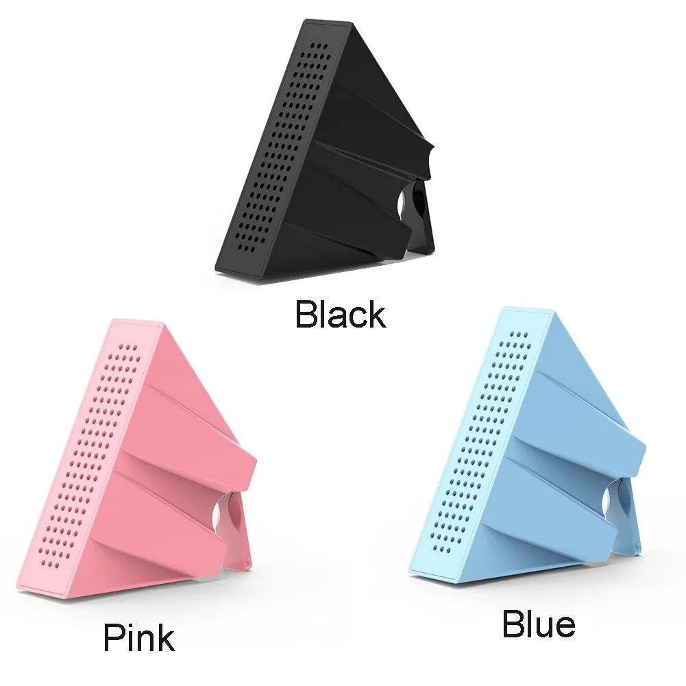 Portable black ABS mobile phone amplifier bracket holding an iPhone on a desk