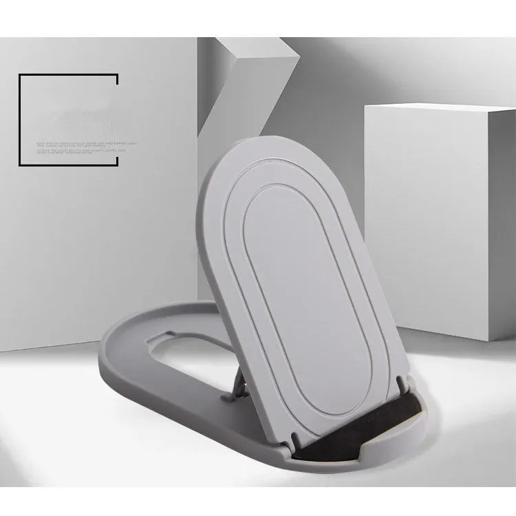 Plastic lazy bracket mobile phone stand in six colour options holding a smartphone on a wooden desk.