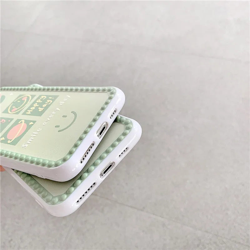 Green iPhone case with geometric smiley face designs and polka dot frames on flexible TPU material