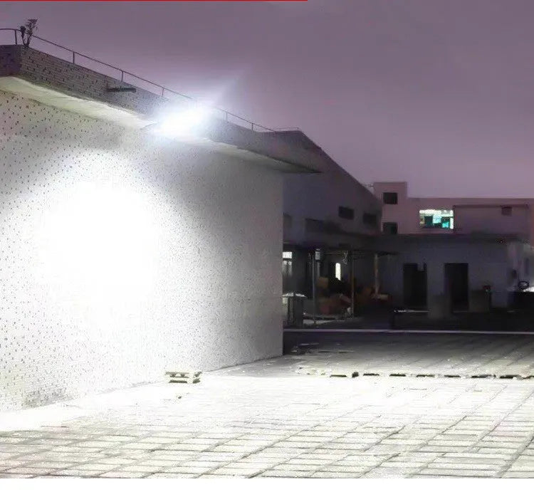 Black solar-powered outdoor wall light with motion sensor for gardens and pathways