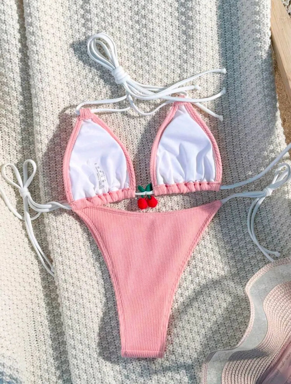 Women's bikini swimsuit set in a briefs style, shown in one of five solid colours: apricot, matcha, orange, pink, or white.