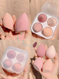 Box containing four coloured makeup sponge eggs in grape, mango, mint, and peach, each roughly 6cm in size.