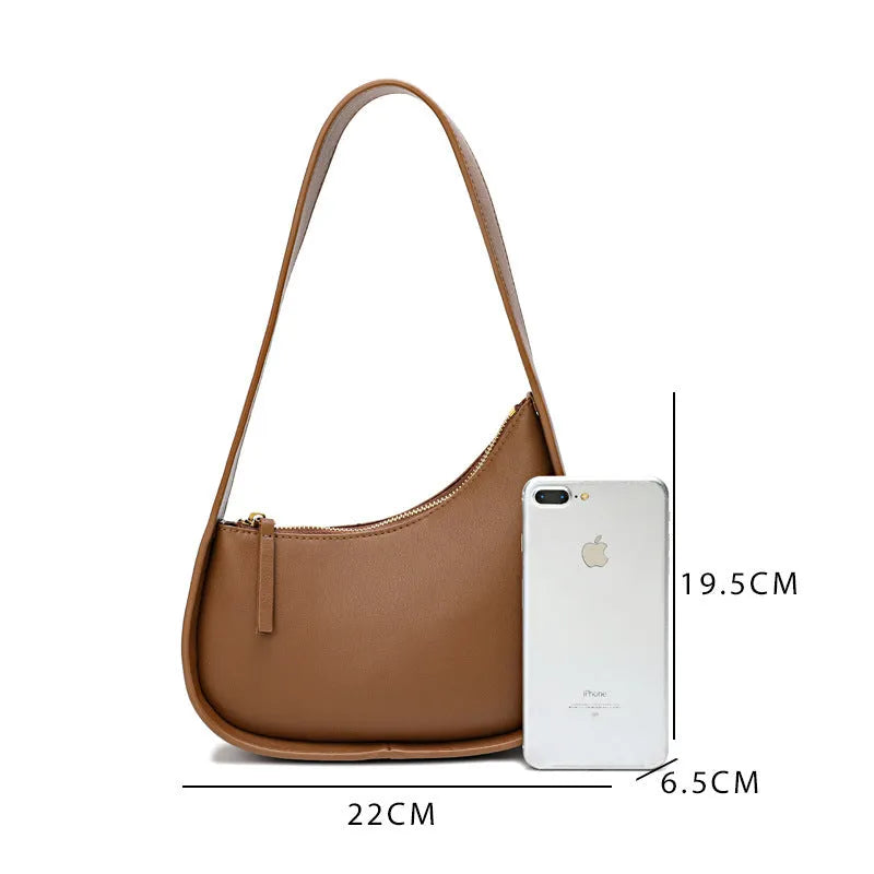 Genuine leather half moon shaped women's shoulder bag with wide strap in caramel colour