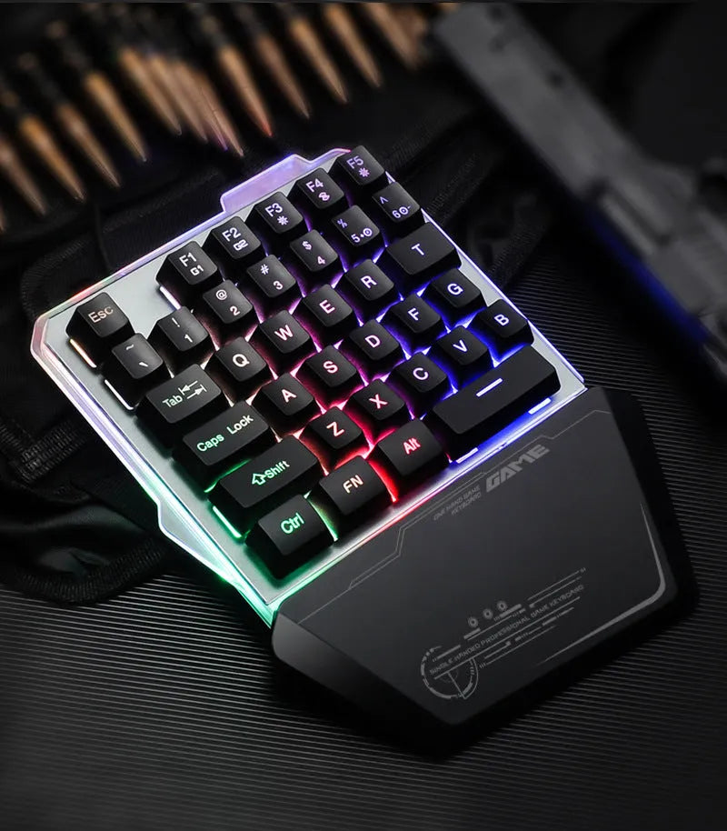 G40 Flow black one-handed robotic keyboard with RGB backlight on a desk.