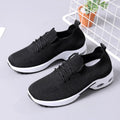 Women's black mesh casual sneakers with round toe and white lace-up front on a soft non-slip sole.