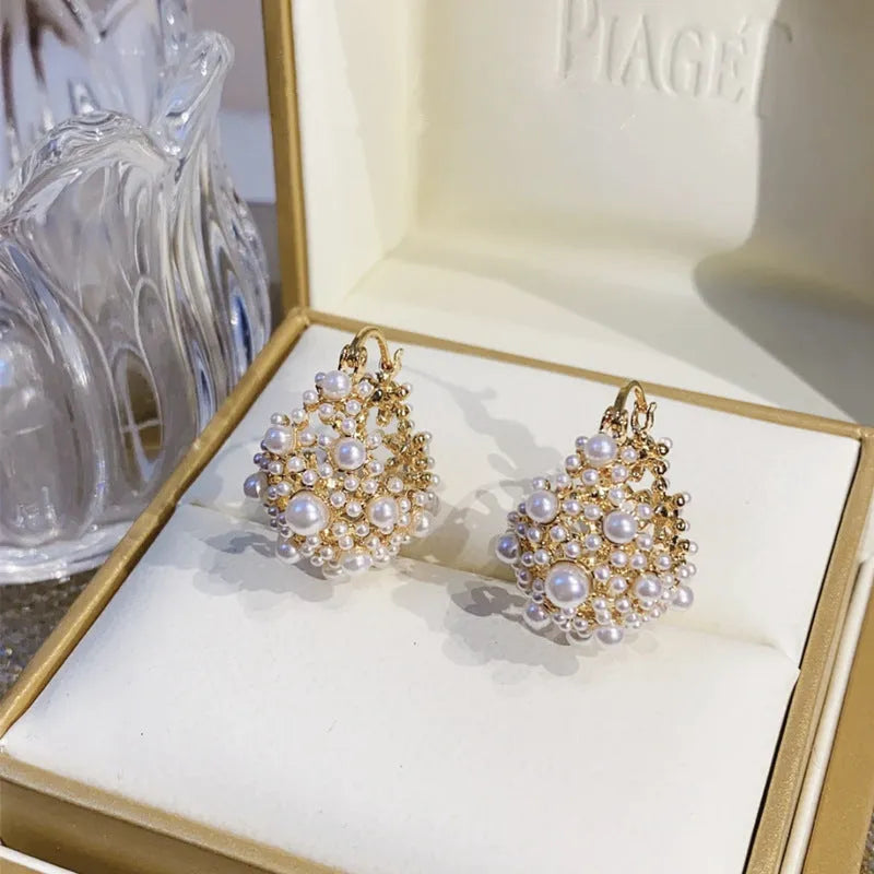 Gold colour women's flower basket earrings with copper construction and rice-shaped bead inlay