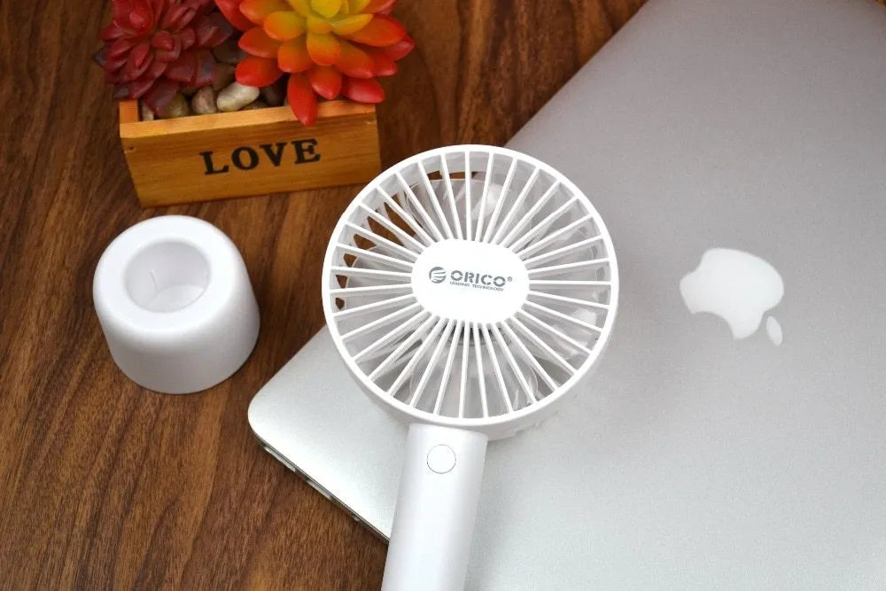 White ORICO FH1 rechargeable USB desktop and handheld fan showing fine line details on its ABS shell.