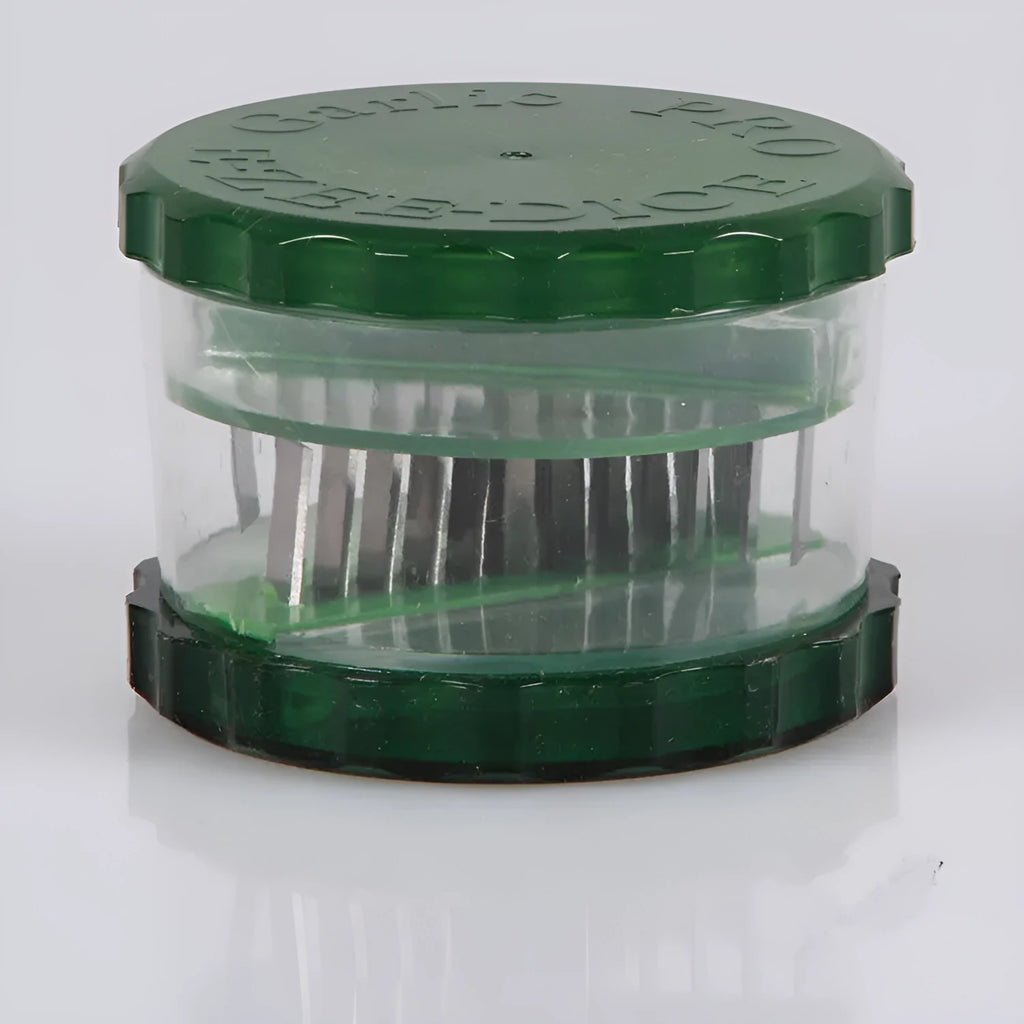 Green transparent plastic garlic peeler kitchen gadget on a countertop.