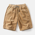 Men's retro American-style cargo shorts in khaki colour with straight-leg cut and multiple pockets