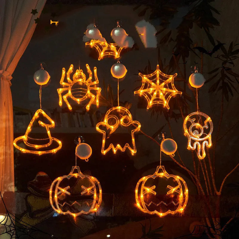 Halloween LED window lights with suction cups showing ghost, spider, and pumpkin decorations