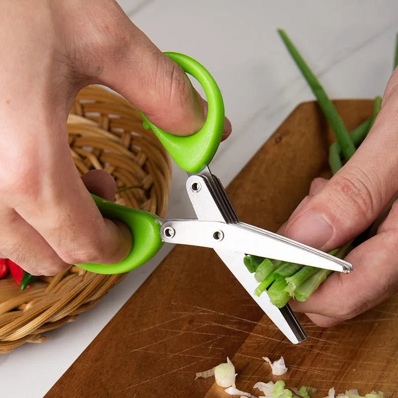Stainless steel multi-layer herb scissors with green handles for chopping green onions and seaweed.
