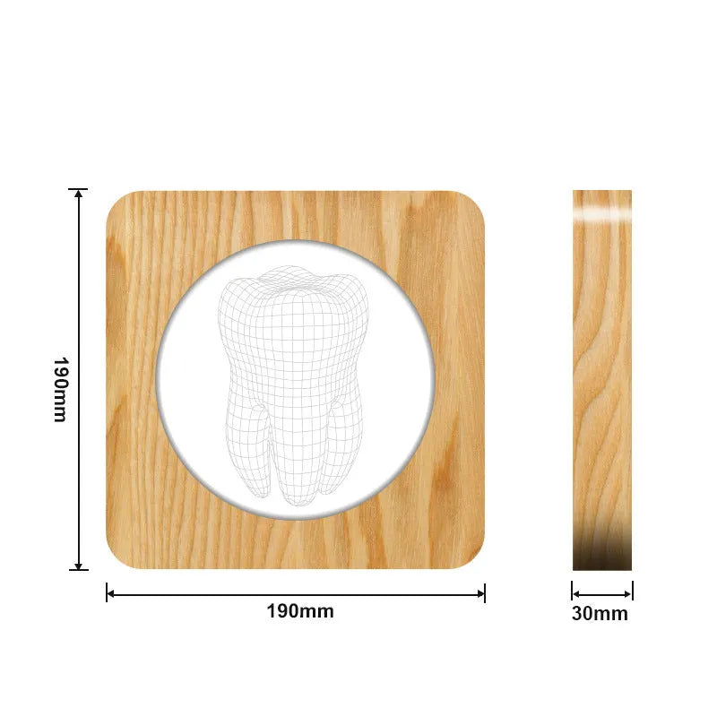 Wood colour tooth-shaped acrylic USB night lamp on a surface