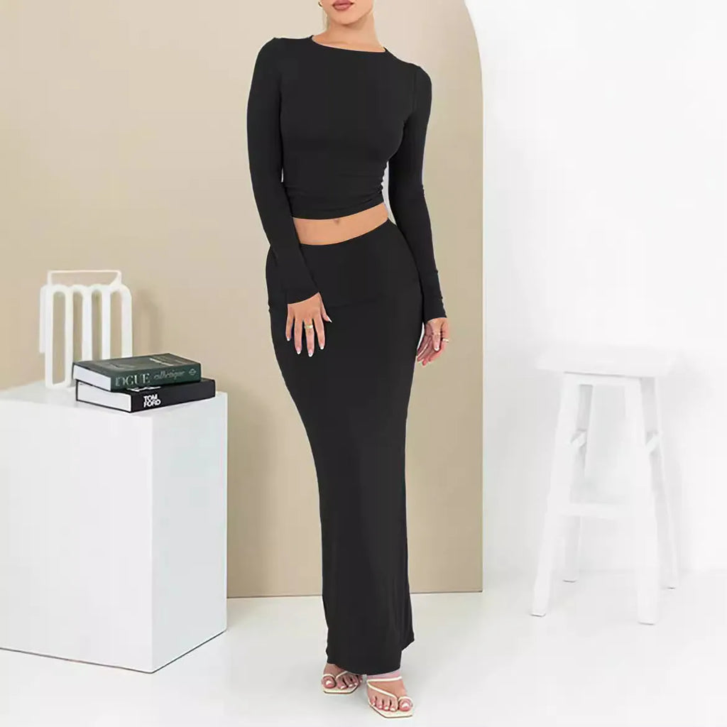 Women's sweet style polyester two-piece suit with three-quarter sleeve top and long skirt.