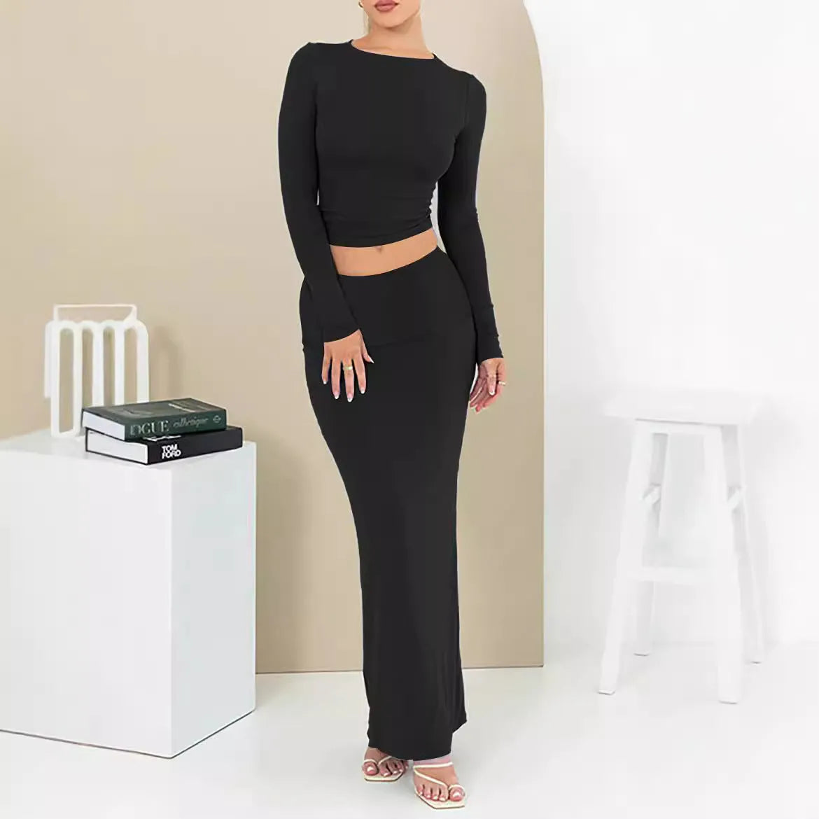 Women's sweet style polyester two-piece suit with three-quarter sleeve top and long skirt.