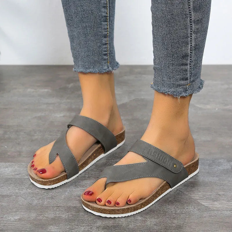 Blue flat toe ring thick-soled flip-flops on a white background.