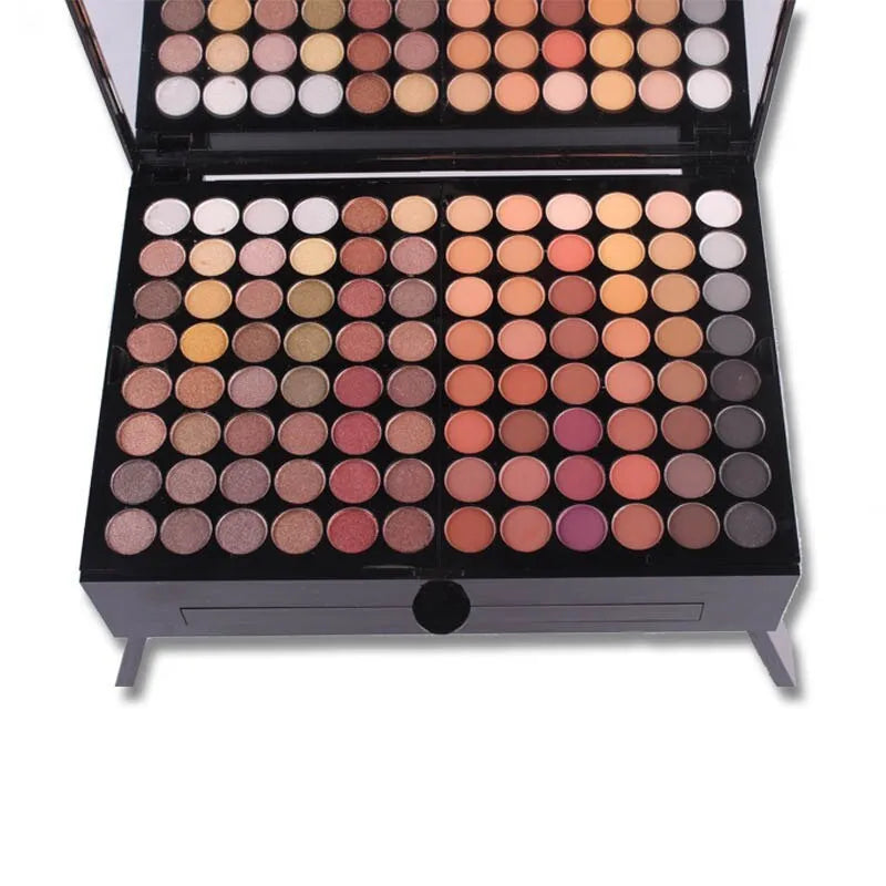 Piano-shaped makeup palette open to show 180 eyeshadows, 2 blushes, and 8 contour powders