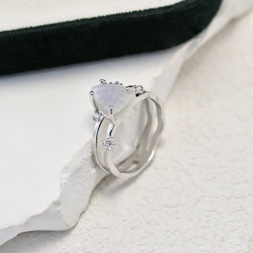S925 sterling silver ring with irregular triangle shape, moonstone, and electroplated rose gold finish.