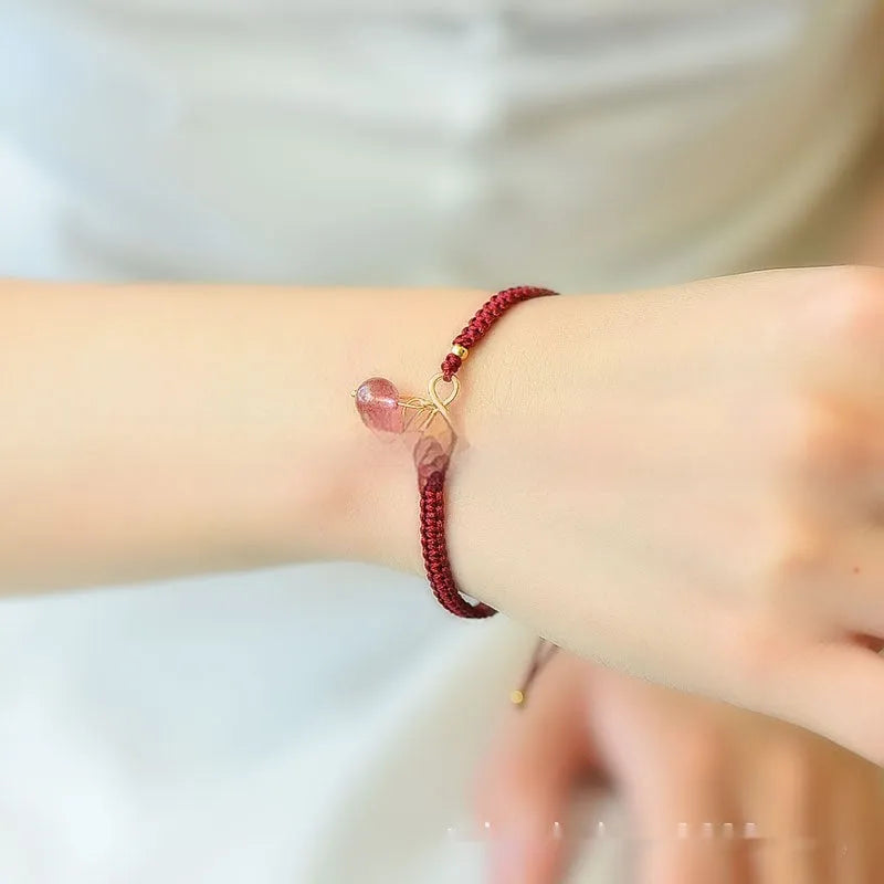 Women's bracelet with a natural strawberry-shaped crystal charm in one of three colour choices.