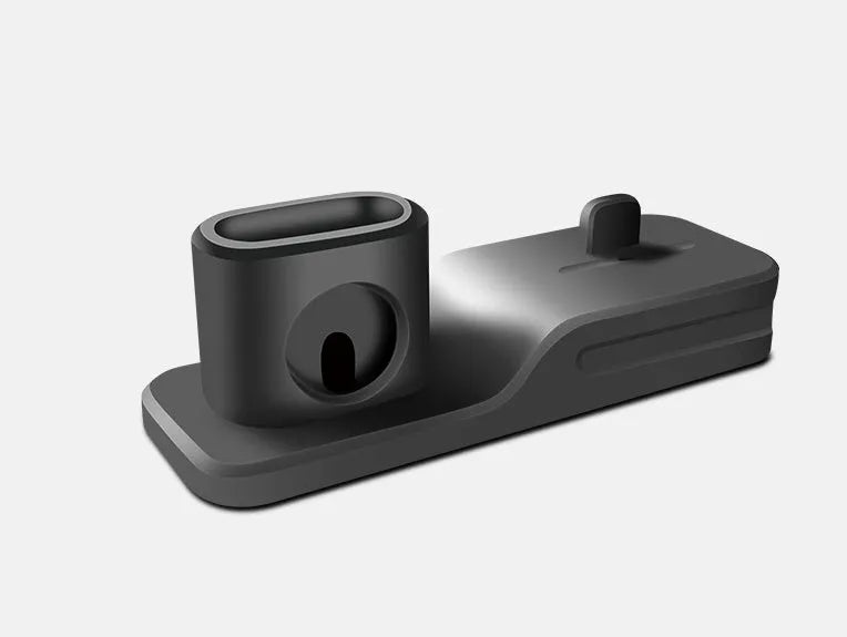 Black silicone 3-in-1 charging base for Apple-compatible iPhone, iWatch and AirPods devices on flat surface