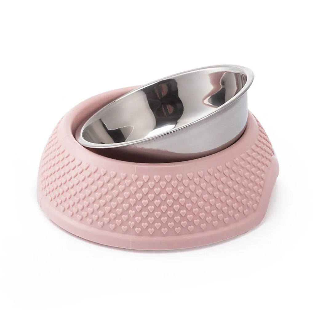 Set of four coloured stainless steel pet bowls with non-slip bases on a table.