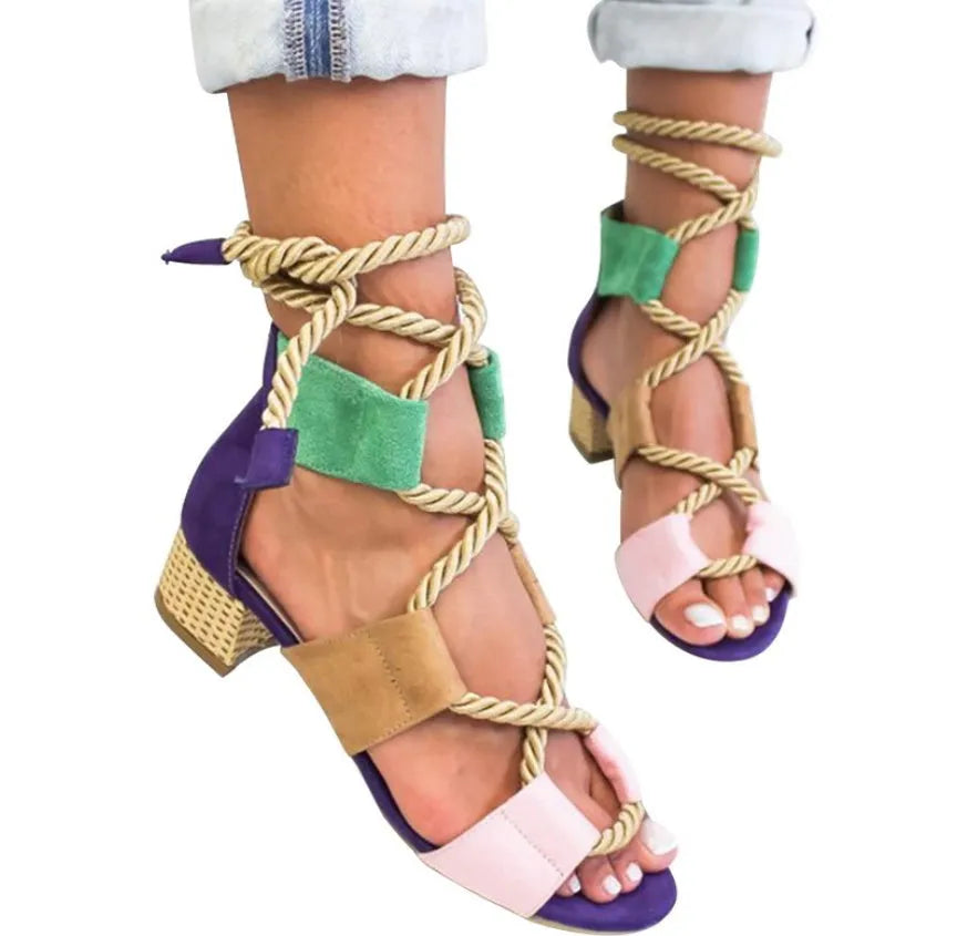 Women's beige suede sandals with thick middle heel, fish mouth toe, and ankle strap.