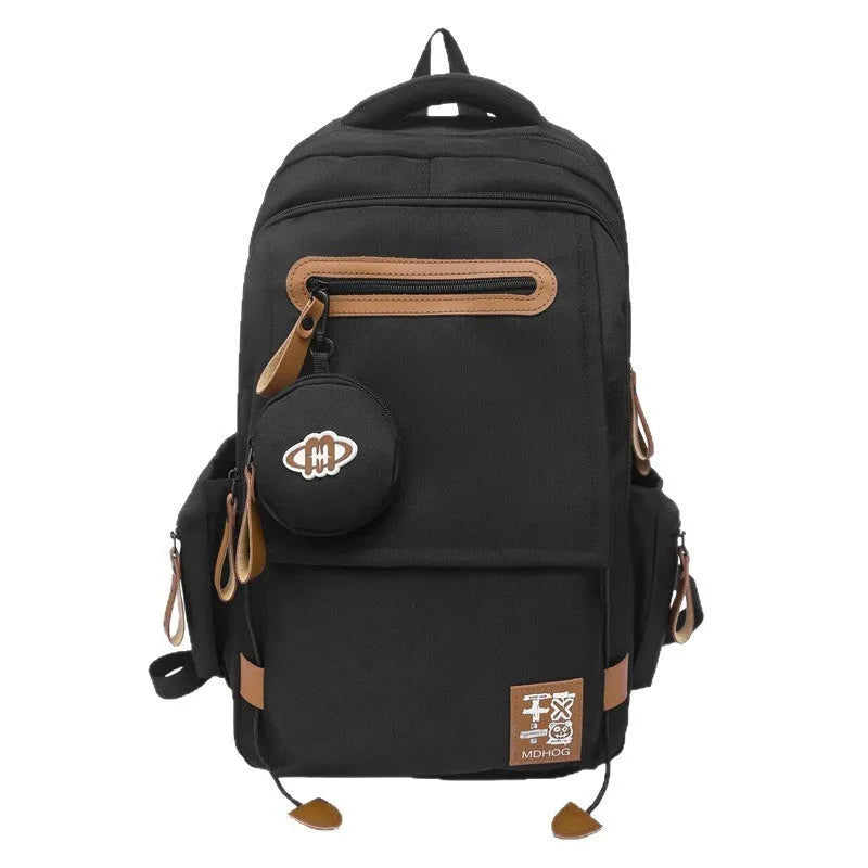 Japanese leisure travel backpack in black with contrast stitching and 20-35 litre capacity