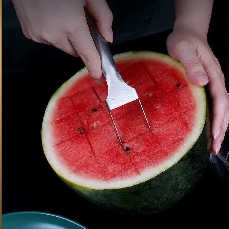 Stainless steel watermelon slicer with fork head showing 26cm length