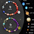 Two natural stone beaded bracelets for zodiac signs on a wrist, showing adjustable closure.