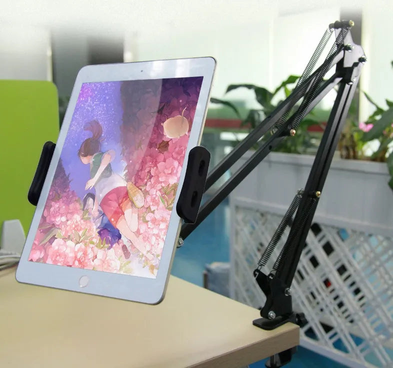 Black and white phone tablet stand on desk holding mobile device