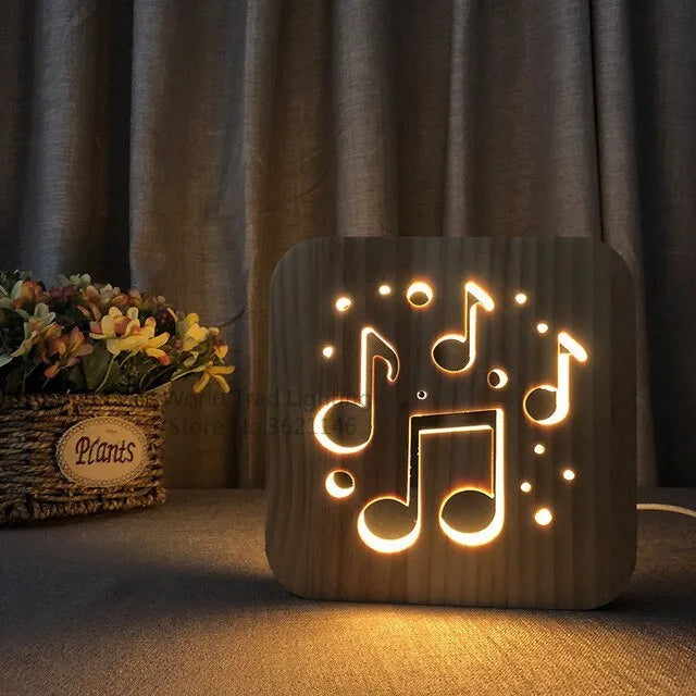 A cubic wooden LED atmosphere lamp with warm white light, shown with a USB cable.