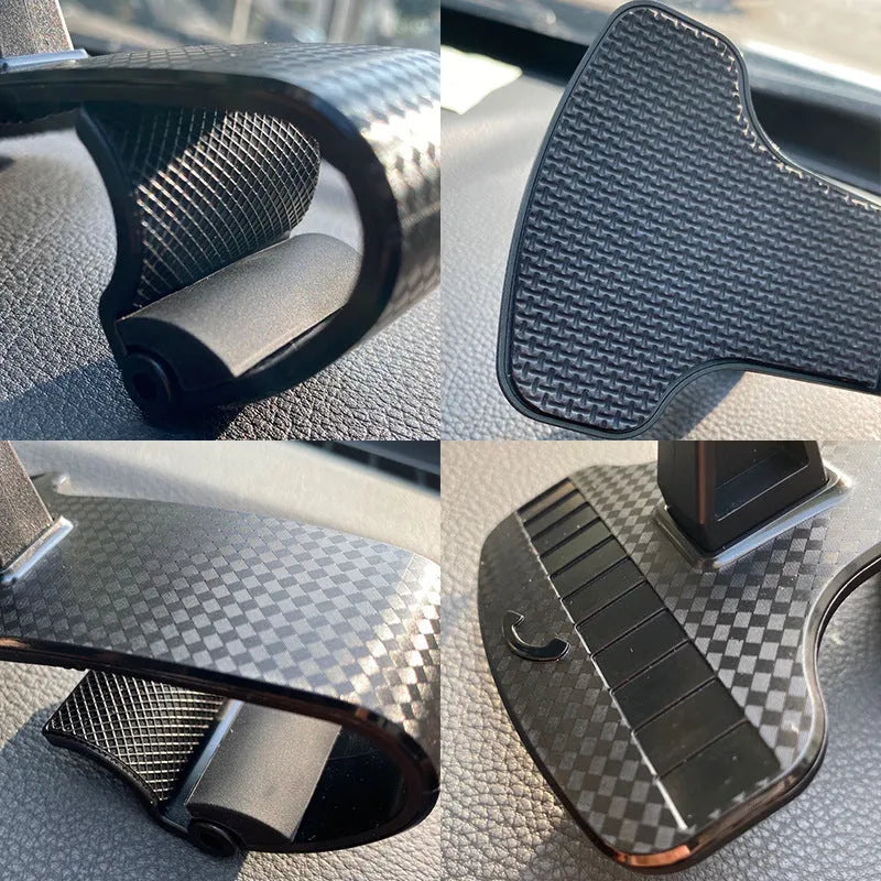 Black 360-degree rotating car phone holder with an adjustable width cradle on a car dashboard.