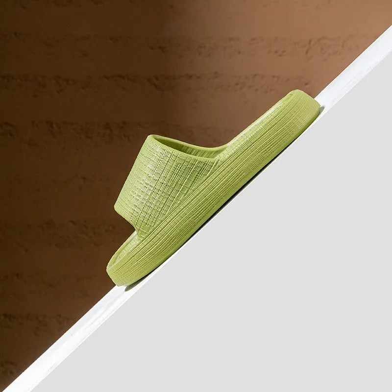A pair of EVA toe ring slippers in a chosen colour, showing the soft non-slip sole and strap design.