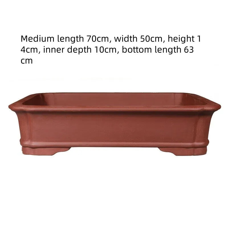 Rectangular handmade purple clay flowerpot showing thickened ceramic walls and substantial planting dimensions