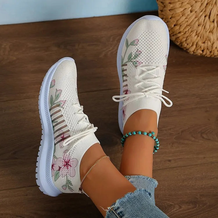 Women's Milky White mesh Flyknit running shoes with flat heel and round toe on a rubber sole.