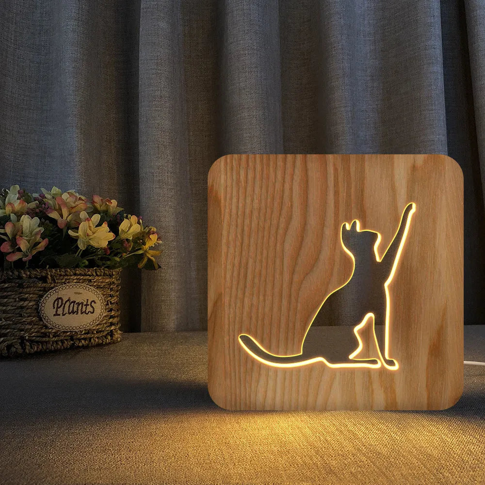 Solid wood 3D cat silhouette night light with hollow design and USB power cord.