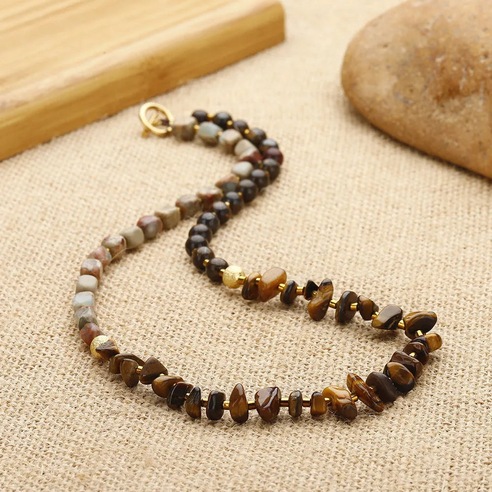 Tigereye stone geometric ball bracelet with bronze setting in brown colour