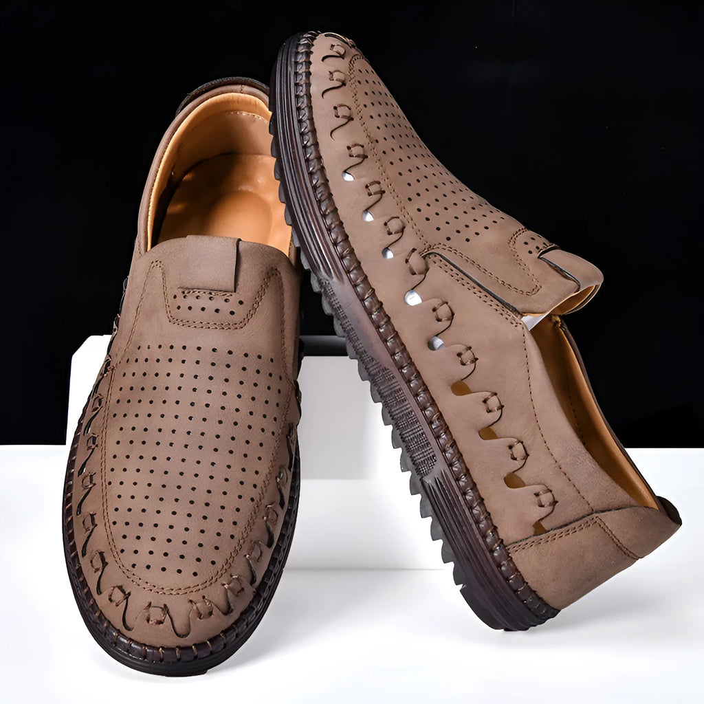 Men's brown artificial PU slip-on casual shoes with leather lining and flat sole.