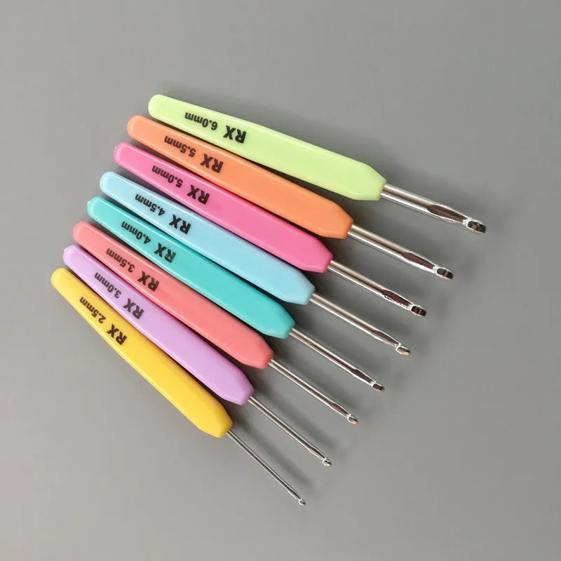Set of 16 crochet hooks with thick and thin handles inside a black PU storage bag.