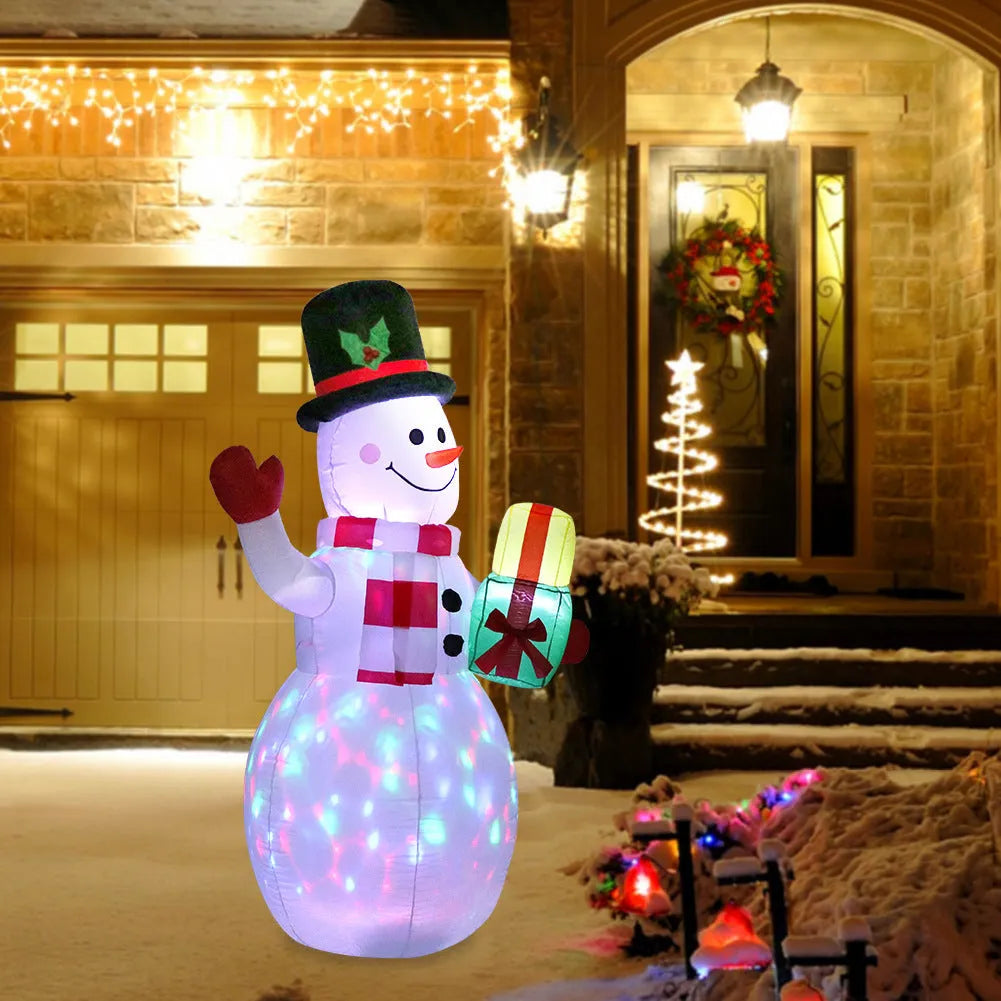 Glowing LED inflatable Christmas decorations including Santa, snowman, and a Christmas tree for outdoor garden use.