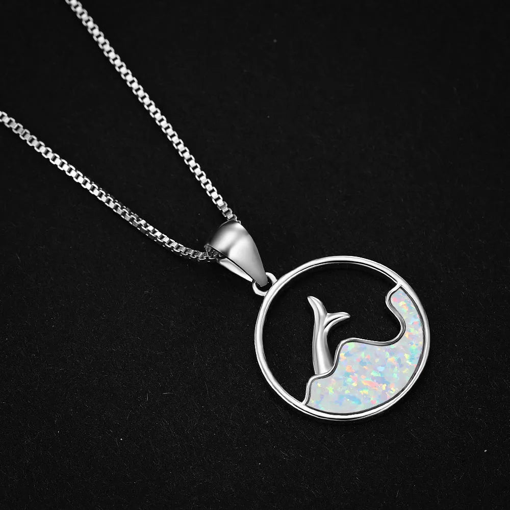 Geometric fishtail pendant necklace with round elements in platinum blue opal colour
