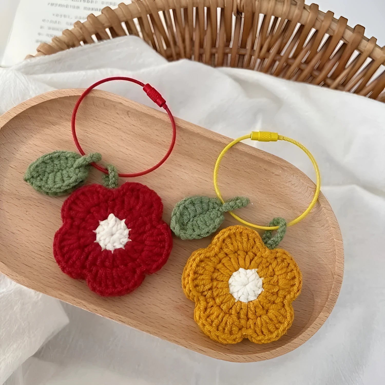 Hand-crocheted wool flower pendant in small red or yellow design for craft and jewellery projects