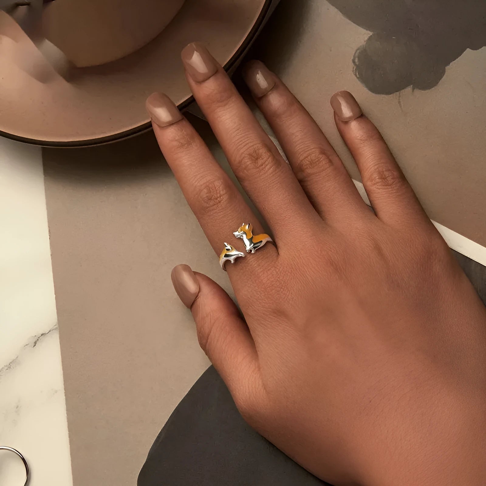 Silver ring with a raised cartoon corgi dog design, colour SCR1014-E.