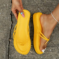 A pair of thick-soled herringbone-style flip-flops in a chosen colour, showing the round toe and rubber bottom.