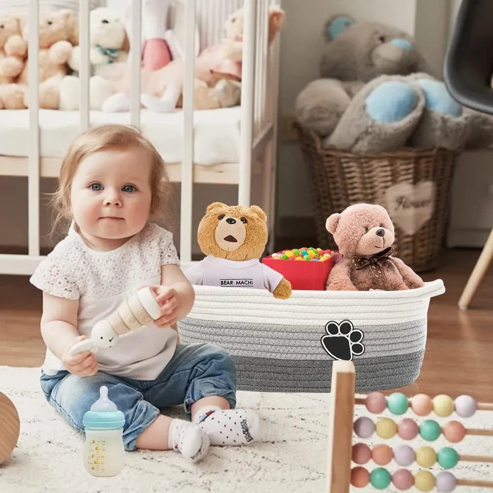 Handmade woven light beige cotton rope storage basket with wooden handles showing 34x26x15cm dimensions