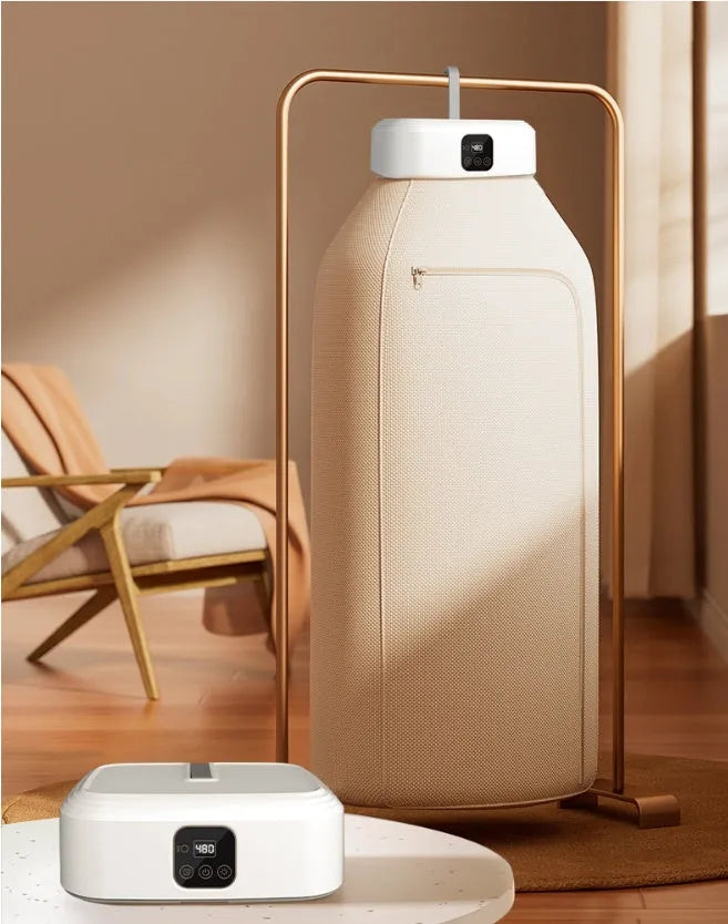 White cylindrical compact clothes dryer with remote control for dormitory use