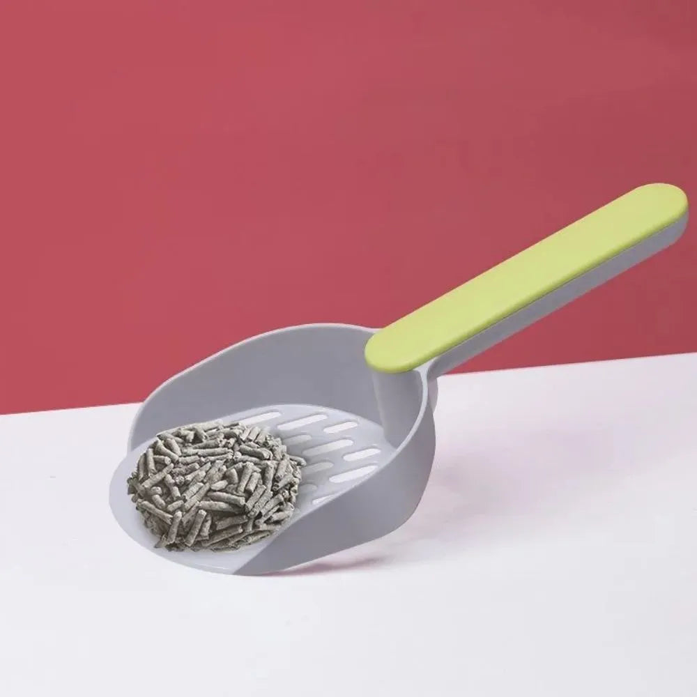 Blue plastic cat litter shovel on a white background showing its size and scoop shape.