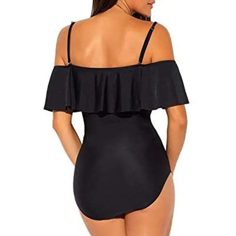 Black one-piece cut-out swimsuit with ruffled straps and tube top style.