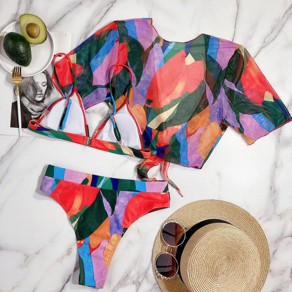 Red printed women's split swimsuit bikini on a mannequin.
