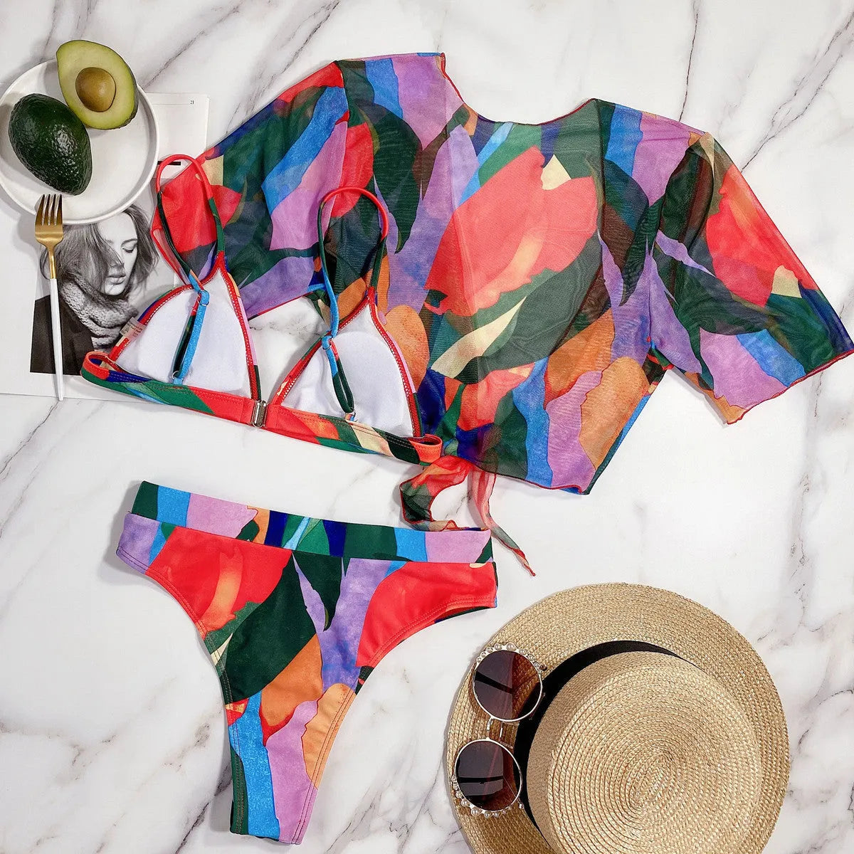 Red printed women's split swimsuit bikini on a mannequin.